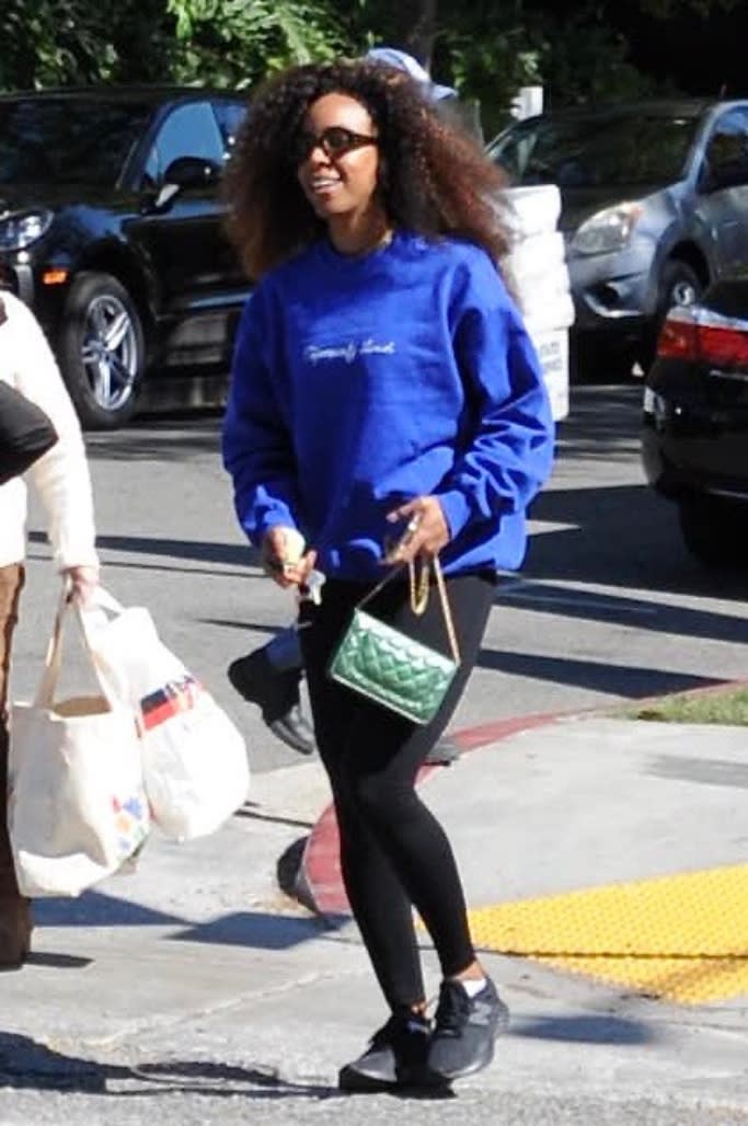 Kelly Rowland wears a royal blue sweatshirt with black leggings and black New Balance athletic shoes on Friday, Feb. 25, 2022. - Credit: Splash