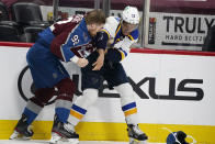 Colorado Avalanche left wing Gabriel Landeskog, left, fights with St. Louis Blues center Brayden Schenn in the first period of Game 1 of an NHL hockey Stanley Cup first-round playoff series Monday, May 17, 2021, in Denver. (AP Photo/David Zalubowski)