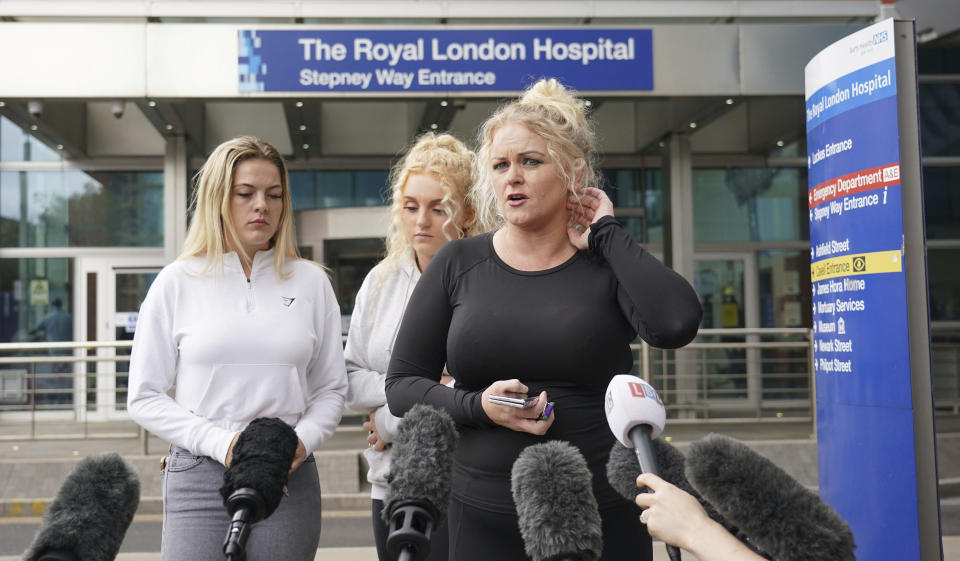 The mother of Archie Battersbee, Hollie Dance (right), speaks to the media outside the Royal London hospital in Whitechapel, east London, Wednesday Aug. 3, 2022. Archie Battersbee, 12, was found unconscious at home with a ligature over his head on April 7, and been in coma since then. His family, at the center of a life-support battle, says it has appealed to the European Court of Human Rights in a last-ditch bid to stop a hospital ending his treatment. (Dominic Lipinski/PA via AP)