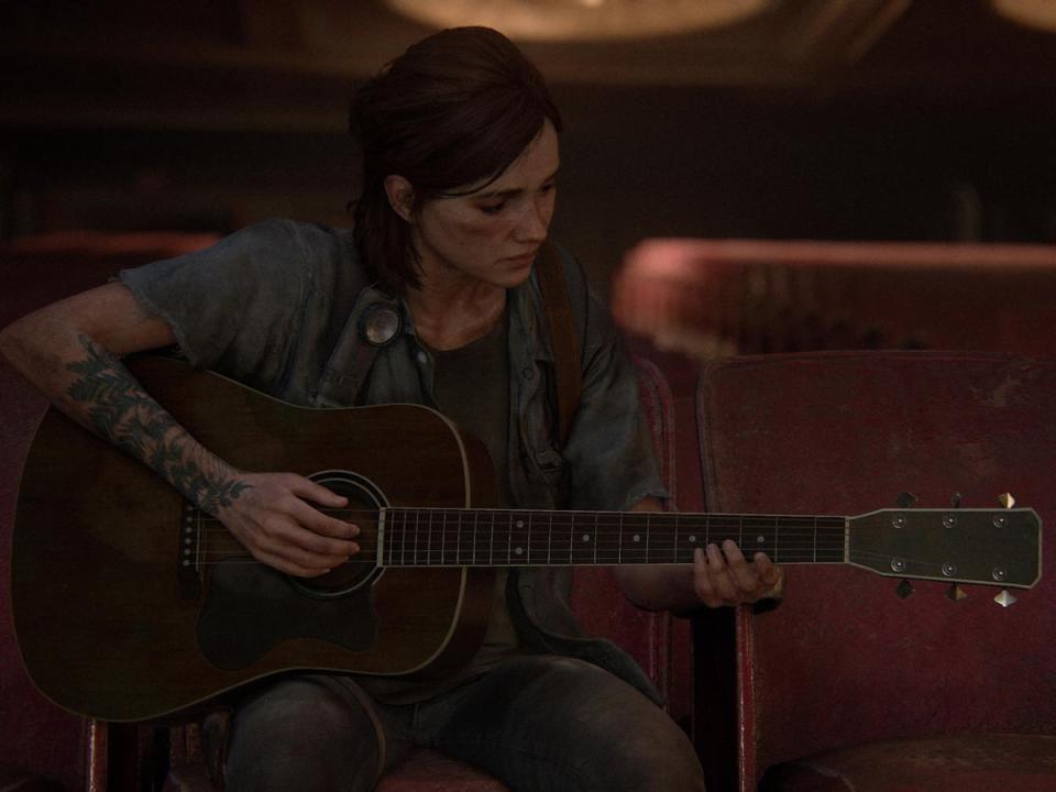 Ellie strums her guitar in a quiet scene from 'The Last of Us Part II' (Naughty Dog)