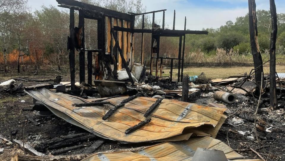 Eliza Doyle's home northwest of Saskatoon was destroyed by a fire on Wednesday. She says the loss included her sister’s home, a storage trailer with her belongings, a lean-to with outdoor items, and a sea can that she had converted into a living space. 