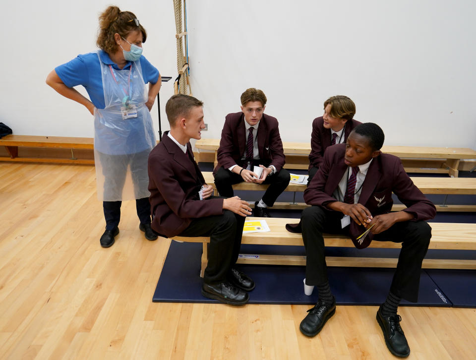 <p>EMBARGOED TO 1300 MONDAY SEPTEMBER 20 Students talk to a nurse after receiving Covid-19 vaccinations at Belfairs Academy, Leigh-on-Sea, Essex. Picture date: Monday September 20, 2021.</p>
