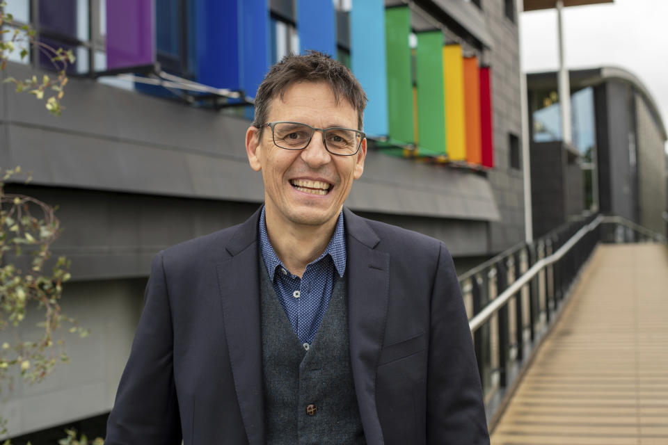 In this image provided by Cambridge University showing Didier Queloz, 53, Tuesday Oct. 8, 2019, after he was named as a recipient of the 2019 Nobel Prize in Physics. Canadian-American cosmologist James Peebles and two Swiss scientists, Didier Queloz and Michel Mayor, have jointly won this year's Nobel Prize in Physics on Tuesday for their work in understanding how the universe has evolved from the Big Bang, and the Earth's place in it. (Cambridge University via AP)