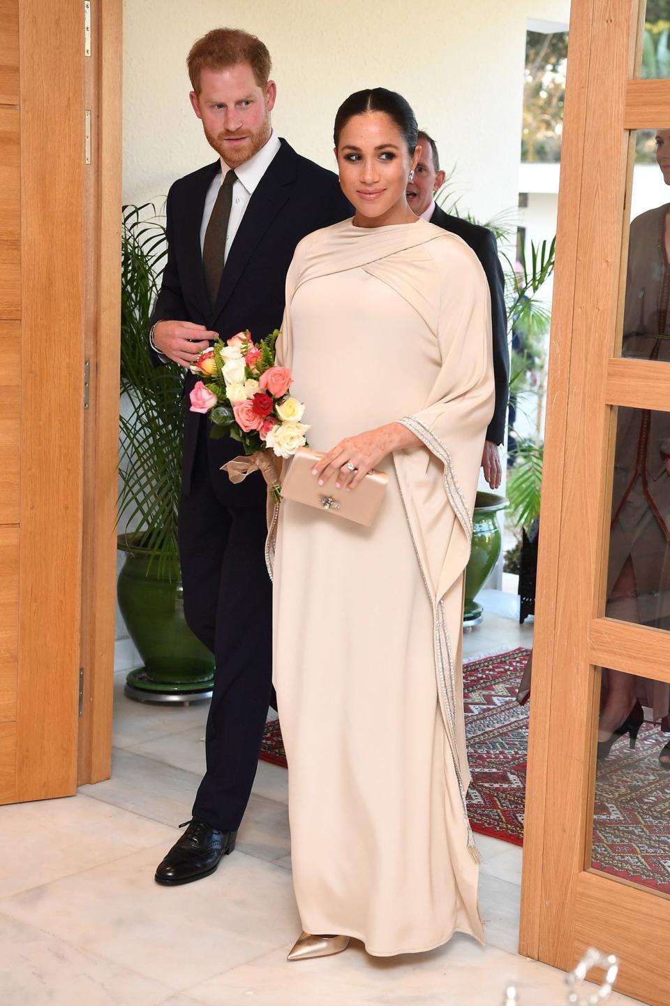 The Duke and Duchess of Sussex <a href="https://people.com/royals/meghan-markle-prince-harry-morocco-reception/" rel="nofollow noopener" target="_blank" data-ylk="slk:stepped out for a reception hosted by the British Ambassador to Morocco looking ultra glamorous;elm:context_link;itc:0;sec:content-canvas" class="link ">stepped out for a reception hosted by the British Ambassador to Morocco looking ultra glamorous</a>. Meghan wore a bespoke cream-colored gown by Dior with gold Dior pumps for a look that was nothing short of elegant. <strong>Get the Look!</strong> Vince Camuto Off the Shoulder Gown, $188; <a href="https://click.linksynergy.com/deeplink?id=93xLBvPhAeE&mid=1237&murl=https%3A%2F%2Fshop.nordstrom.com%2Fs%2Fvince-camuto-off-the-shoulder-gown-regular-petite%2F4539863&u1=PEO%2CShopping%3AEverythingYouNeedtoCopyMeghanMarkle%27sChicSummerStyle%2Ckamiphillips2%2CUnc%2CGal%2C6939680%2C201909%2CI" rel="nofollow noopener" target="_blank" data-ylk="slk:nordstrom.com;elm:context_link;itc:0;sec:content-canvas" class="link ">nordstrom.com</a> XSCAPE Off-The-Shoulder Satin Gown, $259; <a href="https://click.linksynergy.com/deeplink?id=93xLBvPhAeE&mid=3184&murl=https%3A%2F%2Fwww.macys.com%2Fshop%2Fproduct%2Fxscape-off-the-shoulder-satin-gown%3FID%3D7619719&u1=PEO%2CShopping%3AEverythingYouNeedtoCopyMeghanMarkle%27sChicSummerStyle%2Ckamiphillips2%2CUnc%2CGal%2C6939680%2C201909%2CI" rel="nofollow noopener" target="_blank" data-ylk="slk:macys.com;elm:context_link;itc:0;sec:content-canvas" class="link ">macys.com</a> Dessy Collection Surplice Ruched Chiffon Gown, $273; <a href="https://click.linksynergy.com/deeplink?id=93xLBvPhAeE&mid=1237&murl=https%3A%2F%2Fshop.nordstrom.com%2Fs%2Fdessy-collection-surplice-ruched-chiffon-gown%2F4470479&u1=PEO%2CShopping%3AEverythingYouNeedtoCopyMeghanMarkle%27sChicSummerStyle%2Ckamiphillips2%2CUnc%2CGal%2C6939680%2C201909%2CI" rel="nofollow noopener" target="_blank" data-ylk="slk:nordstrom.com;elm:context_link;itc:0;sec:content-canvas" class="link ">nordstrom.com</a> Adrianna Papell Beaded Wide Sleeve Gown, $339; <a href="https://click.linksynergy.com/deeplink?id=93xLBvPhAeE&mid=3184&murl=https%3A%2F%2Fwww.macys.com%2Fshop%2Fproduct%2Fadrianna-papell-beaded-wide-sleeve-gown%3FID%3D7656115&u1=PEO%2CShopping%3AEverythingYouNeedtoCopyMeghanMarkle%27sChicSummerStyle%2Ckamiphillips2%2CUnc%2CGal%2C6939680%2C201909%2CI" rel="nofollow noopener" target="_blank" data-ylk="slk:macys.com;elm:context_link;itc:0;sec:content-canvas" class="link ">macys.com</a> Zac Zac Posen Perry Gown, $1,190; <a href="https://click.linksynergy.com/deeplink?id=93xLBvPhAeE&mid=42352&murl=https%3A%2F%2Fwww.shopbop.com%2Fzac-posen-perry-gown%2Fvp%2Fv%3D1%2F1559986563.htm%3FfolderID%3D13374&u1=PEO%2CShopping%3AEverythingYouNeedtoCopyMeghanMarkle%27sChicSummerStyle%2Ckamiphillips2%2CUnc%2CGal%2C6939680%2C201909%2CI" rel="nofollow noopener" target="_blank" data-ylk="slk:shopbop.com;elm:context_link;itc:0;sec:content-canvas" class="link ">shopbop.com</a> Sam Edelman Hazel Pumps, $119.95; <a href="http://www.anrdoezrs.net/links/8029122/type/dlg/sid/PEO,Shopping:EverythingYouNeedtoCopyMeghanMarkle'sChicSummerStyle,kamiphillips2,Unc,Gal,6939680,201909,I/https://www.zappos.com/p/sam-edelman-hazel-jute-metallic-leather-spirit-metallic-leather/product/8787889/color/792851" rel="nofollow noopener" target="_blank" data-ylk="slk:zappos.com;elm:context_link;itc:0;sec:content-canvas" class="link ">zappos.com</a> Rachel Zoe London Pumps, $278; <a href="http://www.anrdoezrs.net/links/8029122/type/dlg/sid/PEO,Shopping:EverythingYouNeedtoCopyMeghanMarkle'sChicSummerStyle,kamiphillips2,Unc,Gal,6939680,201909,I/https://www.zappos.com/p/rachel-zoe-london-pump-gold/product/9127549/color/385" rel="nofollow noopener" target="_blank" data-ylk="slk:zappos.com;elm:context_link;itc:0;sec:content-canvas" class="link ">zappos.com</a>