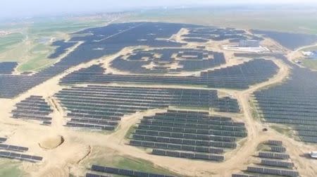 An aerial view shows panda-shaped solar plants built by Panda Green Energy Group in Datong, Shanxi province, China in this still image taken from a video footage, courtesy of Panda Green Energy Group, shot July 21, 2017. Panda Green Energy Group/Handout via REUTERS