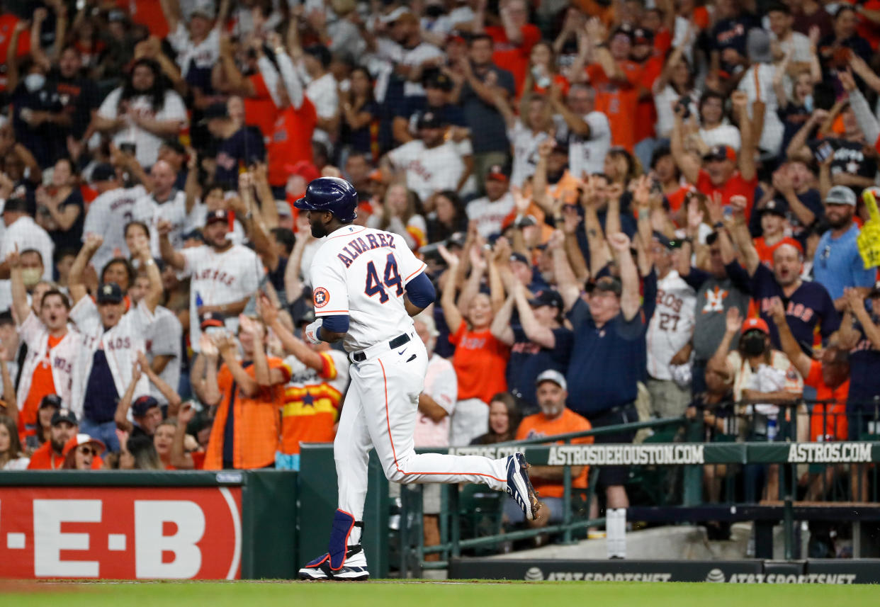 HOUSTON, TEXAS - OCTOBER 02: Yordan Alvarez #44 of the Houston Astros hits a three run home run in the first inning against the Oakland Athletics at Minute Maid Park on October 02, 2021 in Houston, Texas. (Photo by Tim Warner/Getty Images)