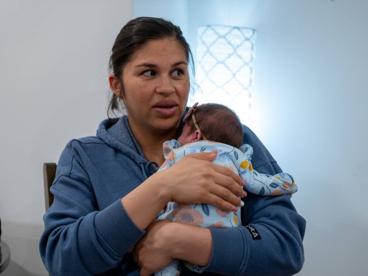 Perla Estrada says was told she had to pay $5,000 upfront for an emergency C-section and that no doctor at the Royal Alexandra Hospital's labour and delivery unit would see her unless she did so. (Emilio Avalos/CBC - image credit)