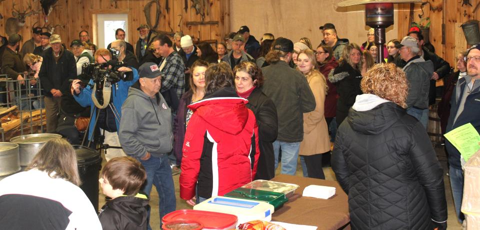 A large crowd gathered Saturday afternoon inside Hillegas Maple Camp in Allegheny Township for the annual tree tapping ceremony to launch the maple season in Somerset County.