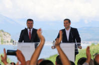 Greek Prime Minister Alexis Tsipras and Macedonian Prime Minister Zoran Zaev speak before the signing of an accord to settle a long dispute over the former Yugoslav republic's name in the village of Psarades, in Prespes, Greece, June 17, 2018. REUTERS/Alkis Konstantinidis