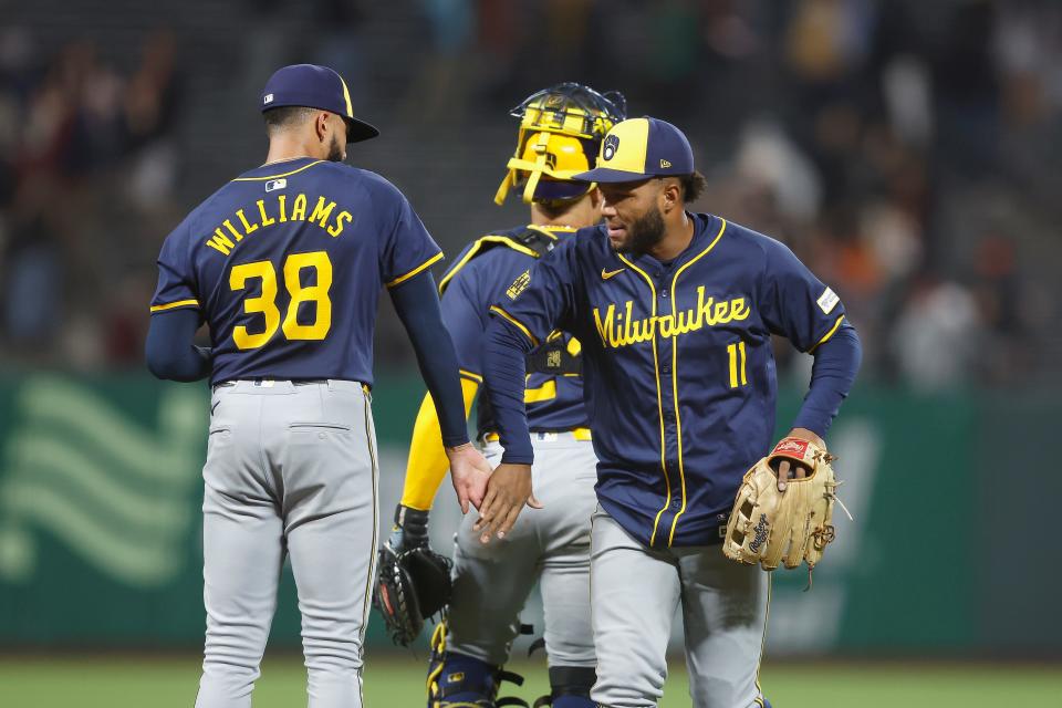 Jackson Chourio celebrates with Devin Williams after a win against the Giants.