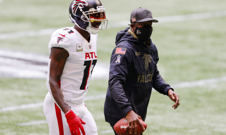 Raheem Morris on the field with Julio Jones.