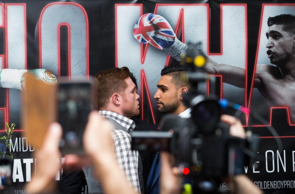 Saul Alvarez (left) and Amir Khan (right) during a press conference ahead of their world title fight (John Walton/PA) (PA Archive)