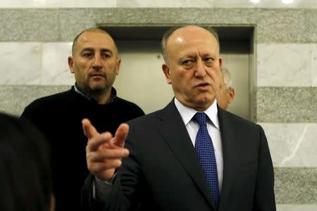 Lebanon's Justice Minister Ashraf Rifi gestures upon his arrival to attend a Cabinet session at the government palace in Beirut, January 22, 2015. REUTERS/Mohamed Azakir