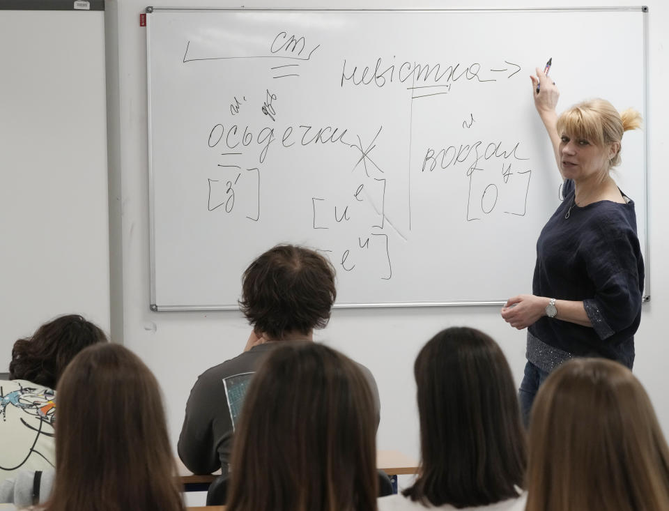 Olha Kovalevska, a teacher of Ukrainian literature at a school run by the Unbreakable Ukraine foundation, teaches literature to prepare students for their final state examinations, in Warsaw, Poland, Saturday June 3, 2023. Russian forces have destroyed 262 educational institutions and damaged another 3,019 in their invasion of Ukraine, according to government figures. For those who've fled to other countries, schooling is suffering in unprecedented ways, according to families, educators, experts and advocates. The effects of war and relocation combined with the challenges of studying in a new country are compounding educational setbacks for young refugees. (AP Photo/Czarek Sokolowski)