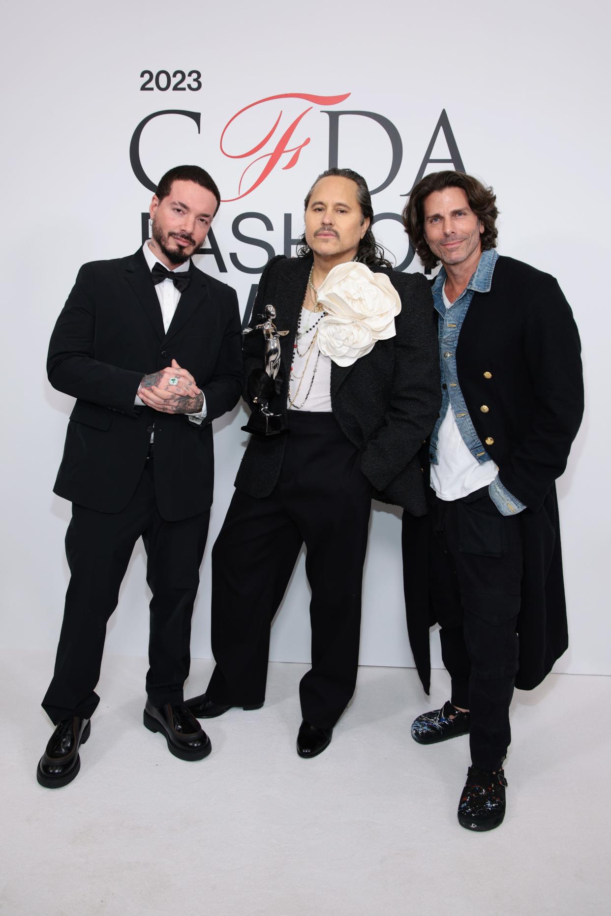 Willy Chavarria, winner of the American menswear designer of the year award, with J Balvin, left, and Greg Lauren, right, at the 2023 CFDA Fashion Awards at American Museum of Natural History on Monday in New York City.