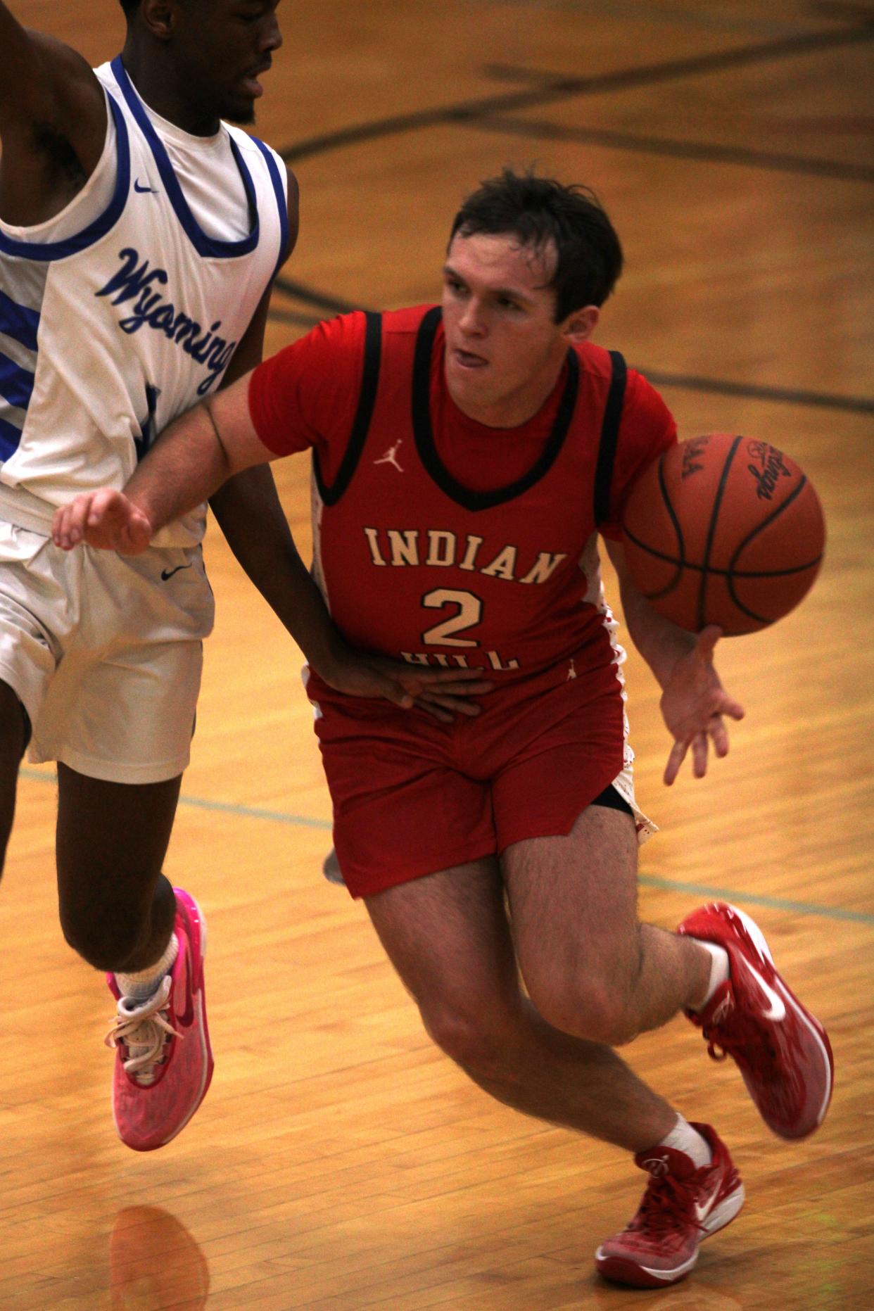 Wyoming's Kellen Wiley causes Indian Hill's John Podojil to lose the ball as Wyoming beat Indian Hill 46-36 in boys basketball to remain undefeated at 7-0, Jan. 5, 2023 at Wyoming High School.