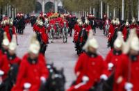 Britain's Queen Elizabeth is driven by carriage as she returns to Buckingham Palace after delivering the State Opening of Parliament in London