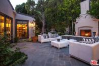 <p>The home also features a stunning outdoor entertainment space with bluestone patio and a fireplace. (Realtor.com) </p>
