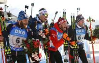 Biathlon - IBU World Championships - Men 4 x 7.5 km Relay - Hochfilzen, Austria - 18/2/17 - Daniel Mesotitsch of Austria, Julian Eberhard of Austria, Simon Eder of Austria and Dominik Landertinger of Austria after finishing. REUTERS/Leonhard Foeger