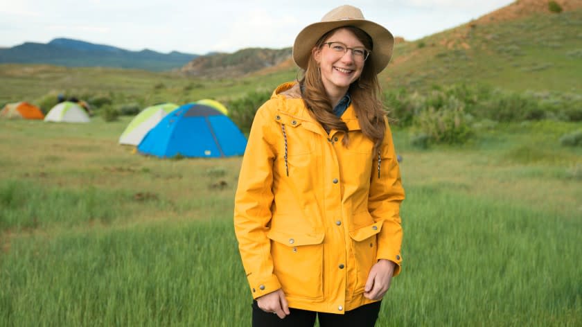 Prehistoric Road Trip -- PBS TV Series, Emily Graslie, sauropod near Hanna, Wyoming. Emily Graslie in "Prehistoric Road Trip" on PBS.