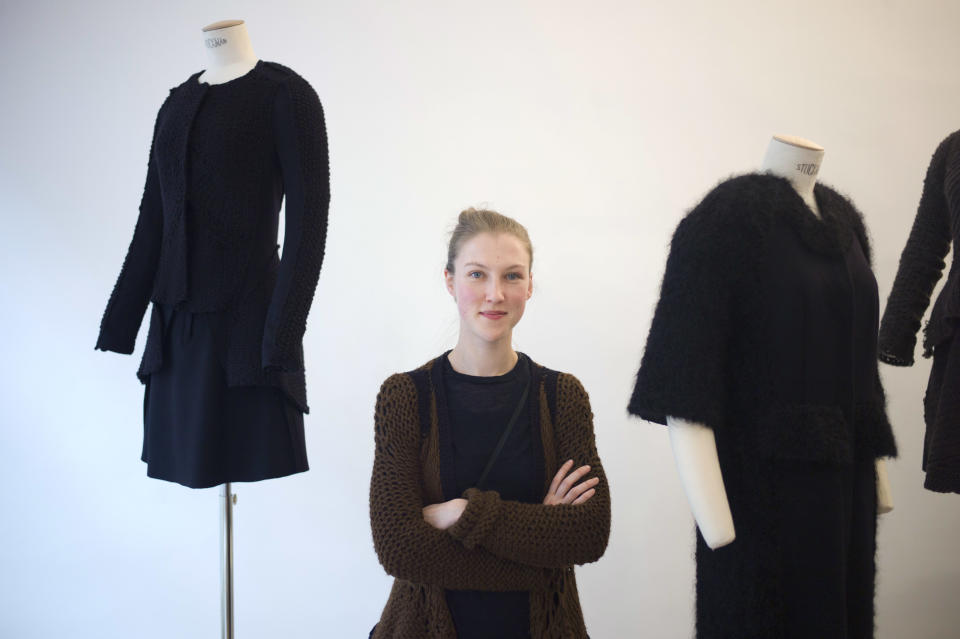 French fashion designer Alice Lemoine poses among her creations as part of the presentation of Le Moine Tricote's ready-to-wear Fall/Winter 2013-2014 collection, presented in Paris, Tuesday, Feb. 26, 2013. (AP Photo/Thibault Camus)