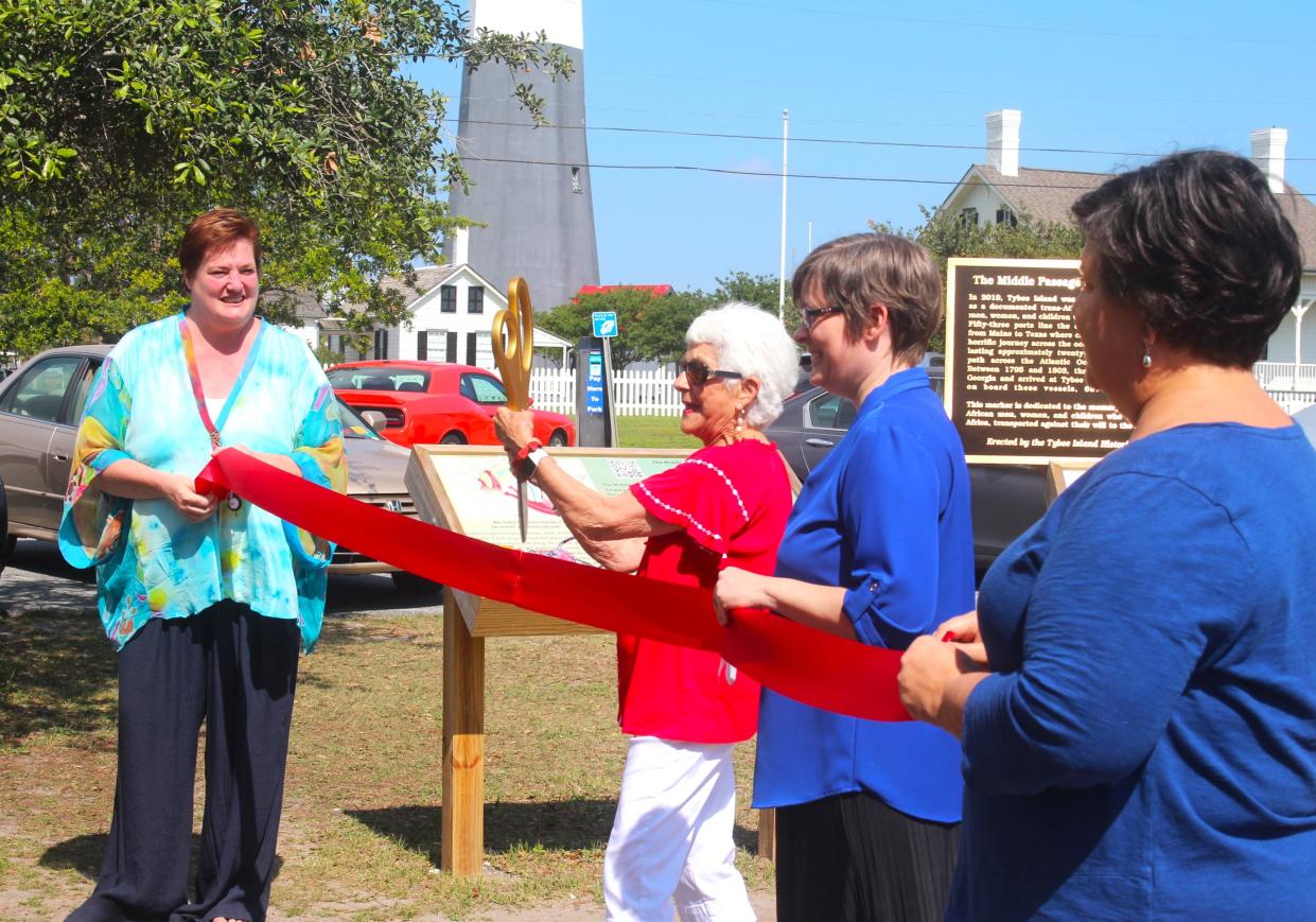 Pat Leiby displays the scissors to cut the ribbon for the virtual Tybee Black History Trail.