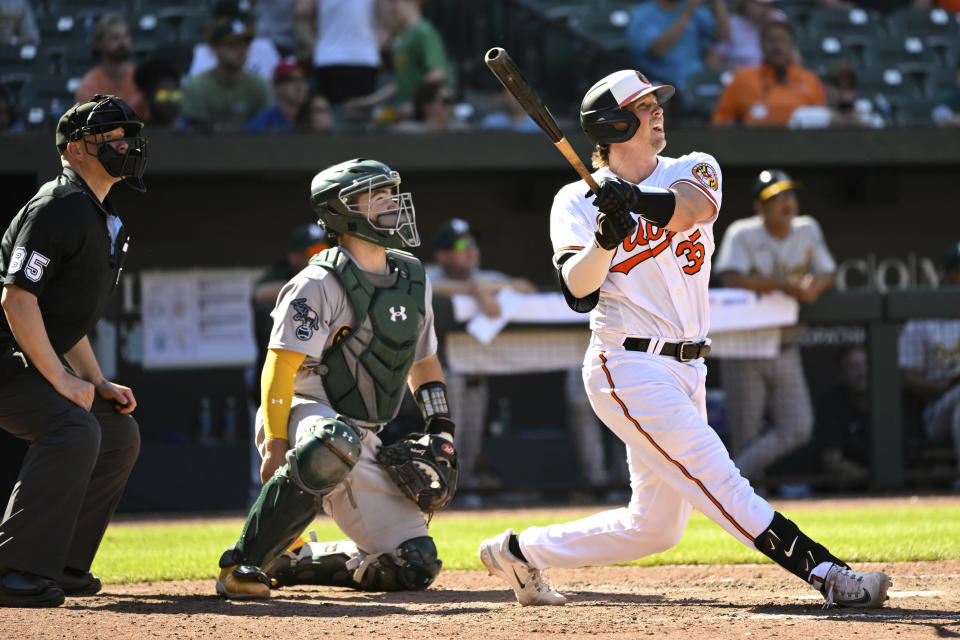 Baltimore Orioles' Adley Rutschman (35) watches his solo walkoff home run hit against Oakland Athletics relief pitcher Trevor May during the ninth inning of a baseball game, Thursday, April 13, 2023, in Baltimore. (AP Photo/Terrance Williams)
