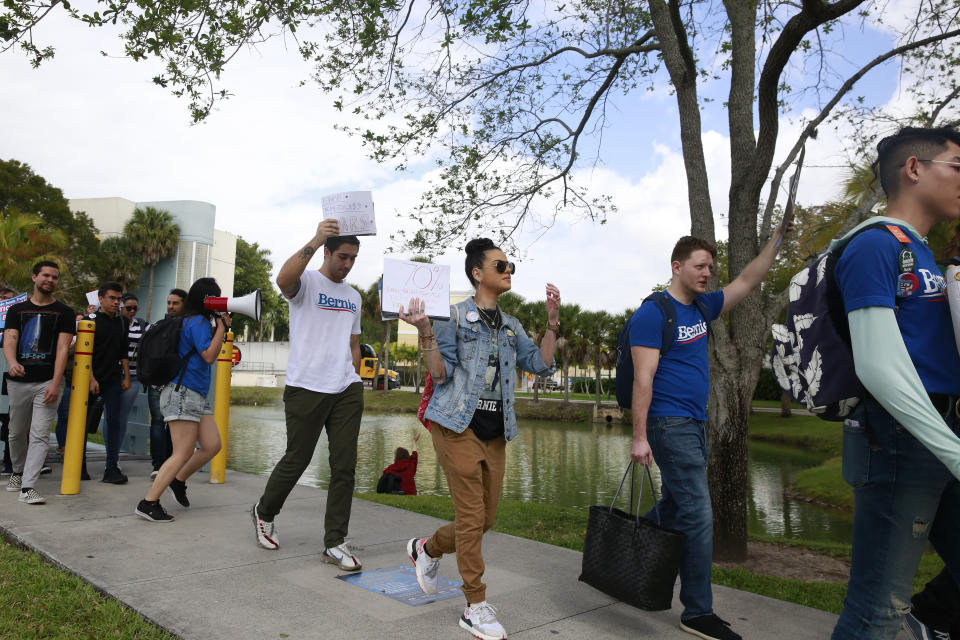 Students chant during the Bernie 2020 March to Early Vote at Florida International University to on Wednesday, March 11, 2020, in Miami. Florida and its 219 delegates could be the knockout punch for presidential hopeful Bernie Sanders after a dismal showing in the Michigan primary. The Florida primary election next Tuesday will be closely watched by people across the nation. (AP Photo/Brynn Anderson)