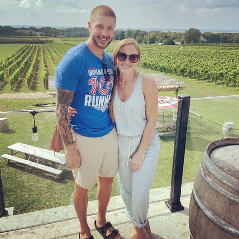<p>Mina Starsiak Hawk Instagram</p> Mina Starsiak Hawk and Steve Hawk pose together at a vineyard.