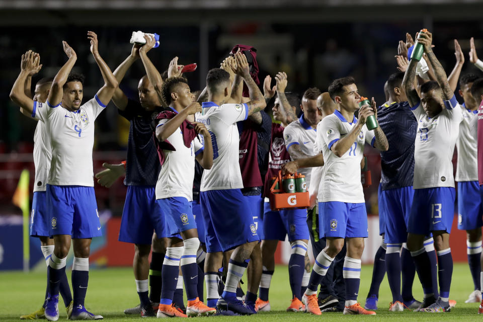 Brazil players celebrate beating 3-0 Bolivia in the opening match of the Copa America at the Morumbi stadium in Sao Paulo, Brazil, Friday, June 14, 2019. (AP Photo/Andre Penner)