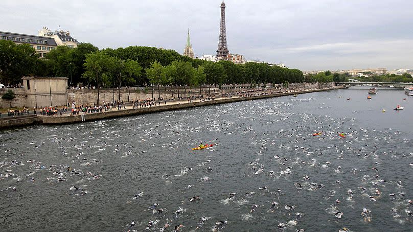 Competitors swim in the Seine River during the Paris Triathlon in July 2011.