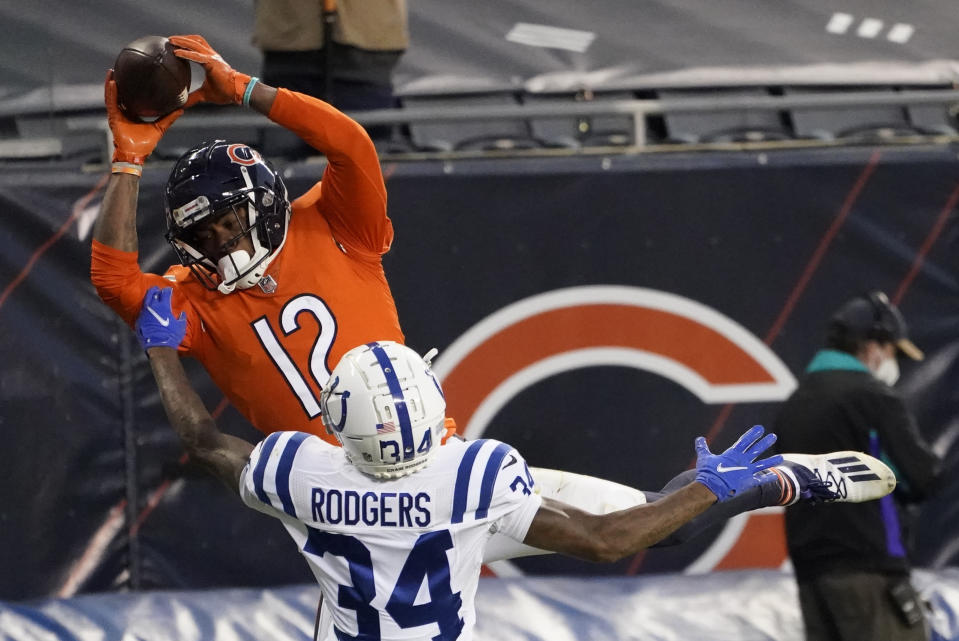 Chicago Bears' Allen Robinson (12) makes a touchdown reception against Indianapolis Colts' Isaiah Rodgers (34) during the second half of an NFL football game, Sunday, Oct. 4, 2020, in Chicago. (AP Photo/Nam Y. Huh)