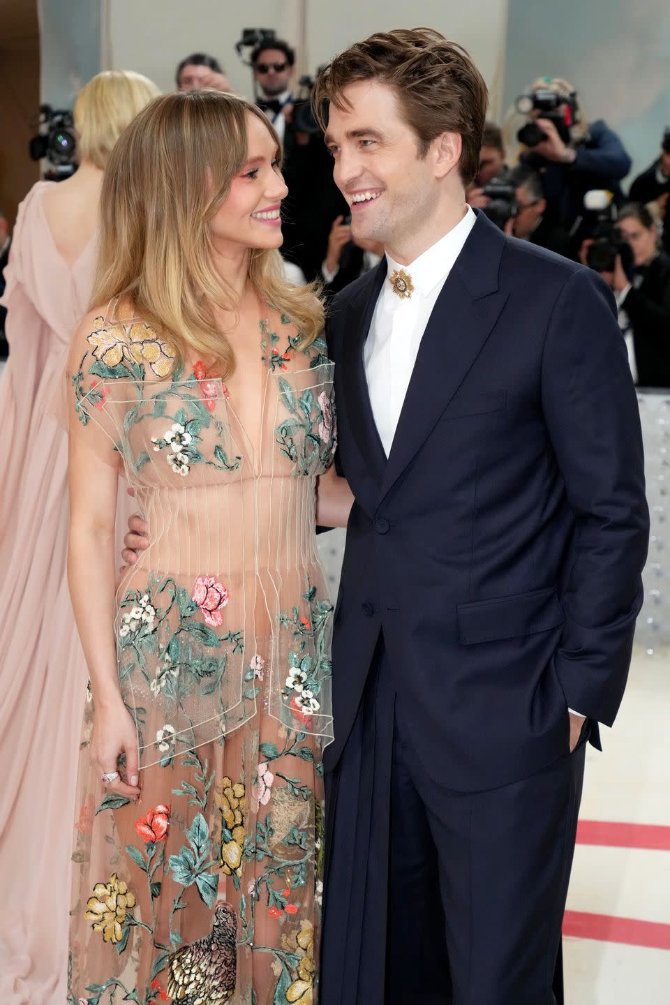 suki waterhouse, robert pattinson smiling together at the met gala, may 2023