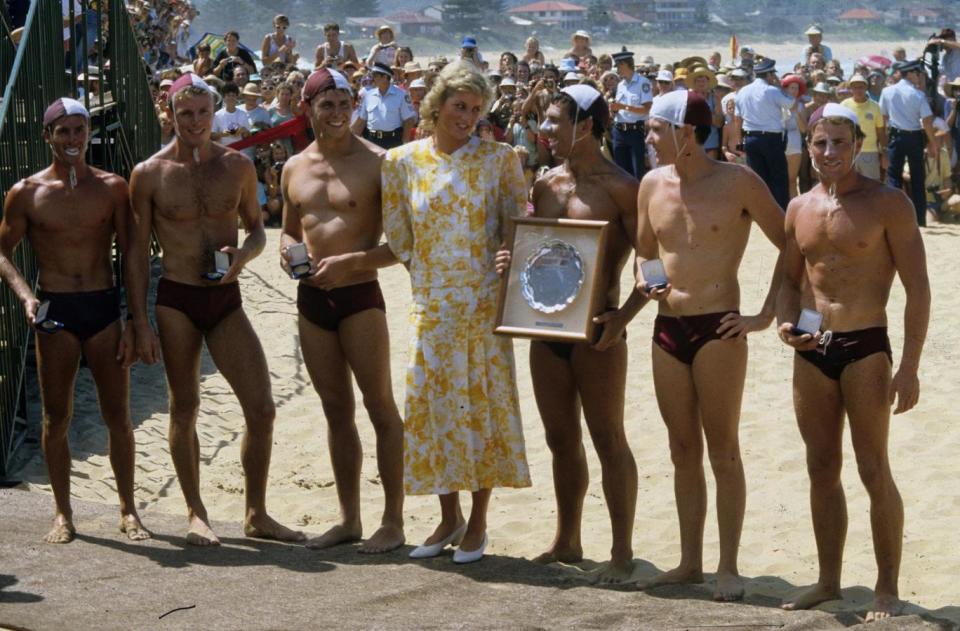 Princess of Wales poses with the winning team of lifeguards at a surf carnival at Terrigal Beach in 1988 (Getty Images)