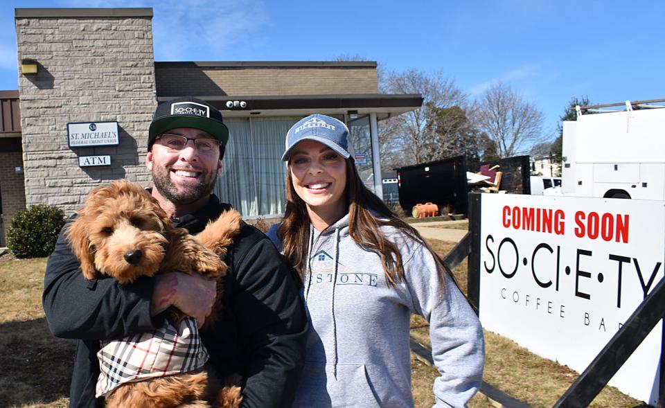 Society Coffee Bar owners Keith and Debra Viveiros with Chino (short for cappuccino) at their new location on County Street in Somerset.