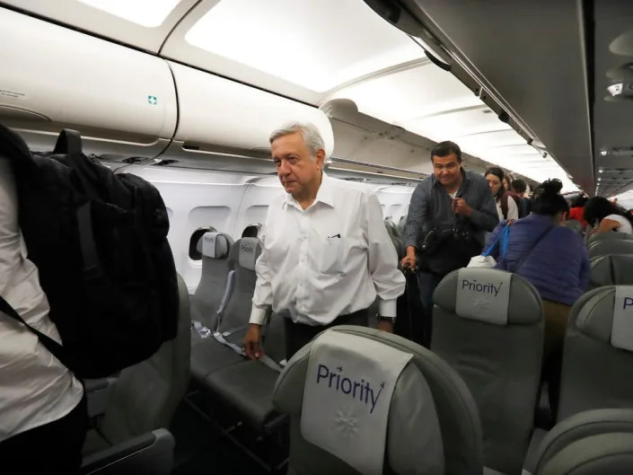 President López Obrador on a commercial flight.