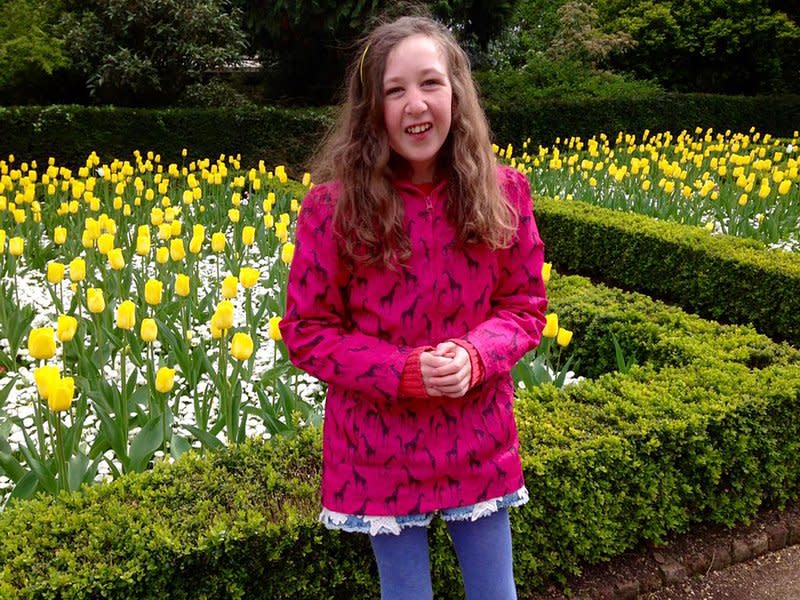 This undated photo released by The Lucie Blackman Trust/Family shows Nora Anne Quoirin standing in a garden.