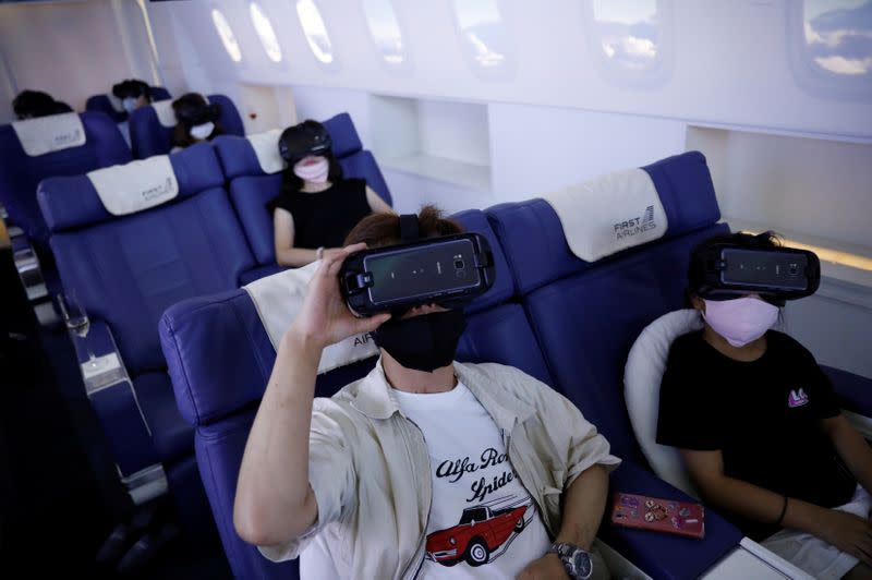 Customers take VR flight experiences at First Airlines in Tokyo