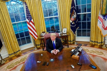 U.S. President Donald Trump answers questions during an exclusive interview with Reuters journalists in the Oval Office at the White House in Washington, U.S. December 11, 2018. REUTERS/Jonathan Ernst