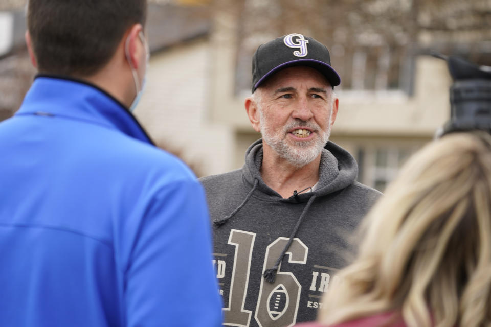 Kirby Klements talks about a piece of debris that crushed his pickup truck parked next to his home in Broomfield, Colo., as the plane shed parts while making an emergency landing at nearby Denver Internatioopnal Airport Saturday, Feb. 20, 2021. (AP Photo/David Zalubowski)