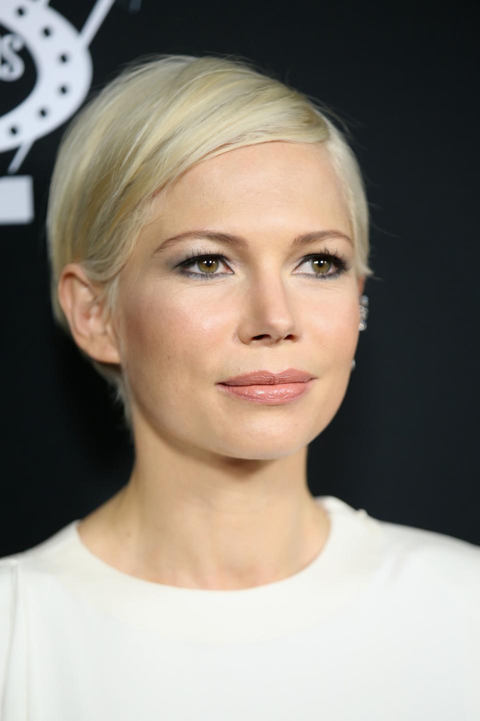<p>We all got a bit of a shock at first when Michelle Williams debuted a sleek peroxide pixie cut but now we couldn’t imagine her without it. [Photo: Getty] </p>