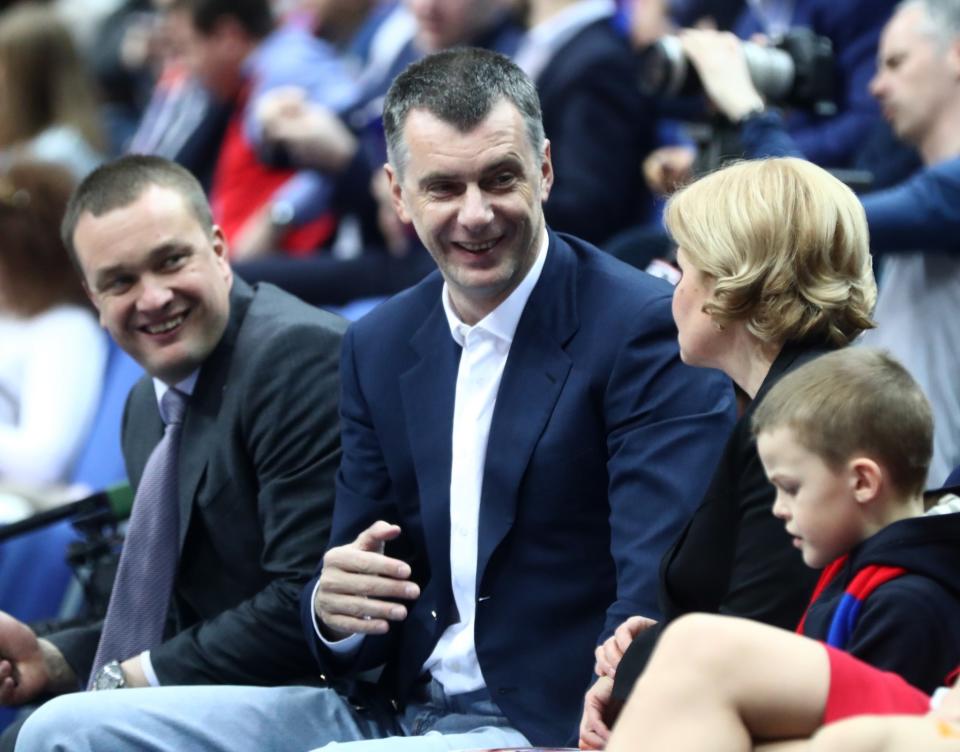 Brooklyn Nets owner Mikhail Prokhorov (center) sits with PBC CSKA Moscow President and CEO Andrei Vatutin and Russia's Deputy Prime Minister Olga Golodets at Thursday's Euroleague playoff game between CSKA Moscow and Baskonia. (Stanislav Krasilnikov\TASS/Getty Images)