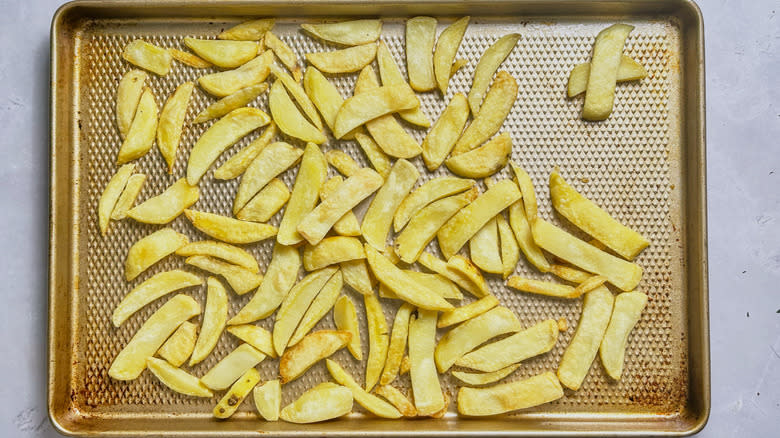 baked fries on baking sheet