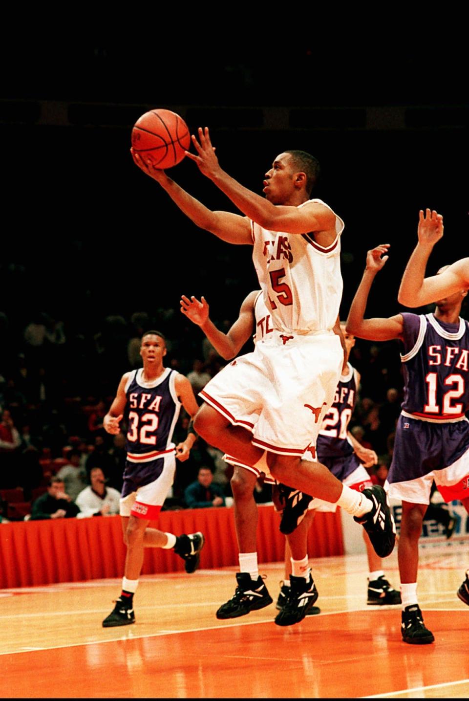 Terrence Rencher (15) starred at Texas in the 1990s and left as the program’s all-time leading scorer (2,306) and steals leader (255).