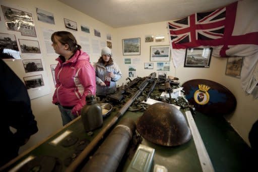 Tourists visit a war museum in San Carlos village in the Falkland Islands, on March 25, 2012. Britain and Argentina on Monday marked 30 years since the invasion of the Falkland Islands triggered a 74-day war, with diplomatic tensions still running high