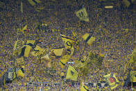 Supporters cheer before the Champions League semifinal first leg soccer match between Borussia Dortmund and Paris Saint-Germain at the Signal-Iduna Park stadium in Dortmund, Germany, Wednesday, May 1, 2024. (AP Photo/Matthias Schrader)