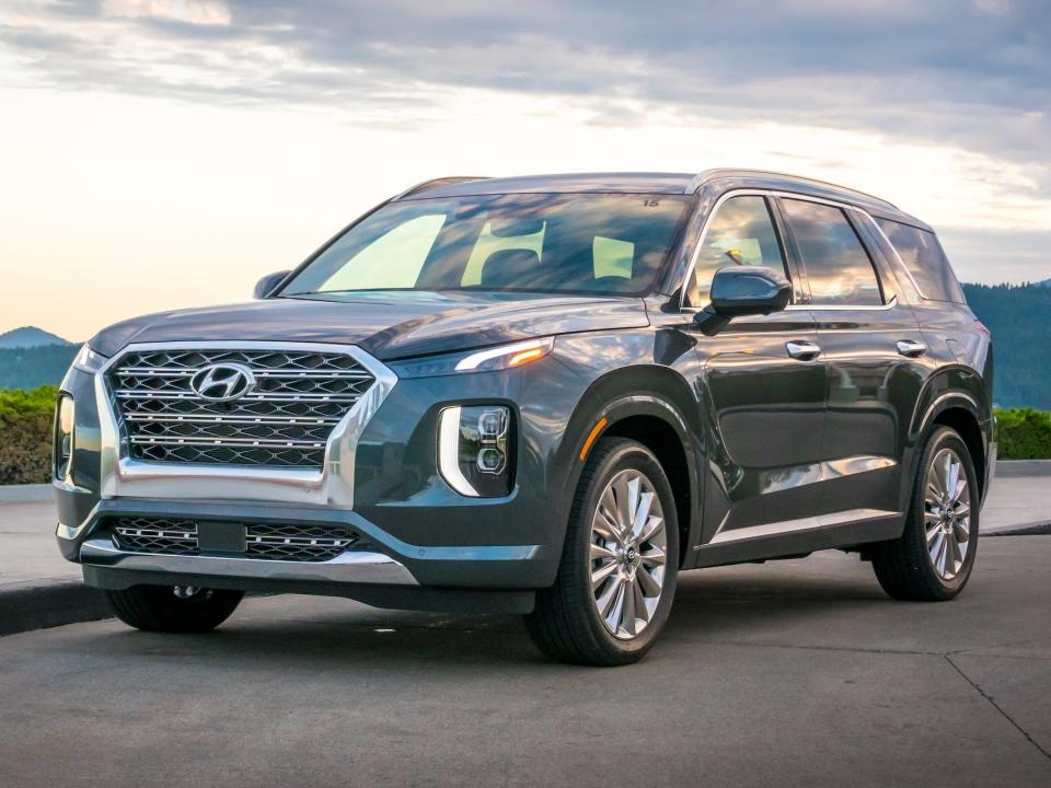 A blue 2020 Hyundai Palisade on a road.