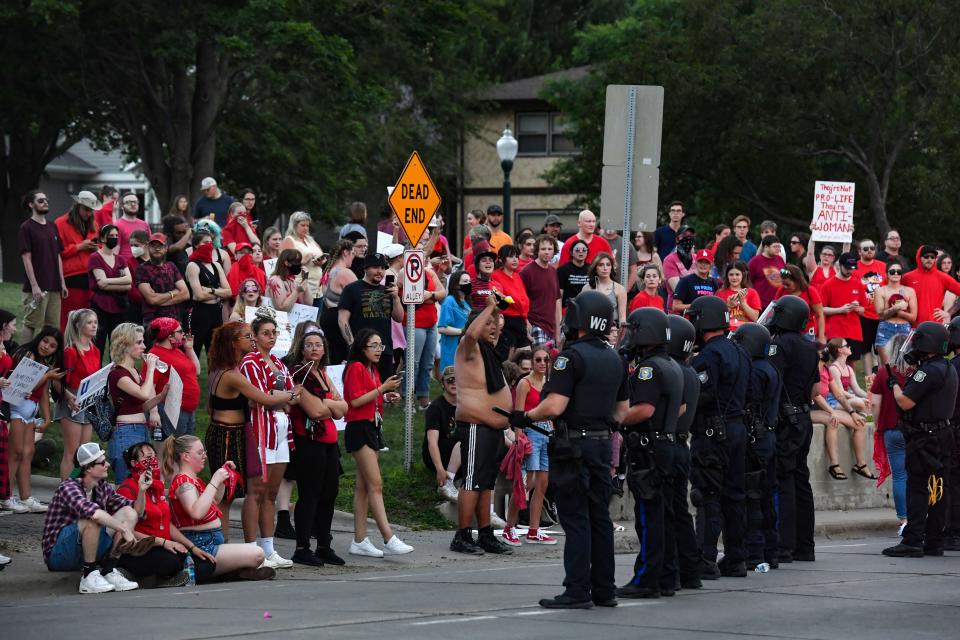 Hundreds of abortion rights protestors gather on the hill at Lyons Park after police move to get a majority of them off the road on Wednesday, June 29, 2022, in Sioux Falls.