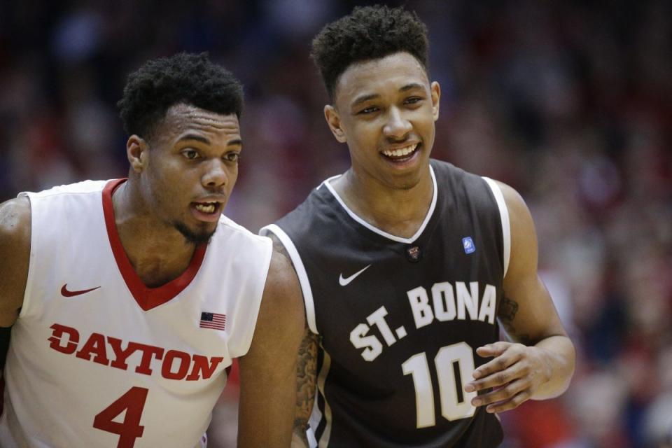 Dayton's Charles Cooke and St. Bonaventure's Jaylen Adams are both league player of the year candidates. (AP)