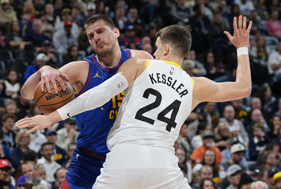 Denver Nuggets center Nikola Jokic, left, drives against Utah Jazz center Walker Kessler during the first half of an NBA basketball game Saturday, March 9, 2024, in Denver. (AP Photo/David Zalubowski)